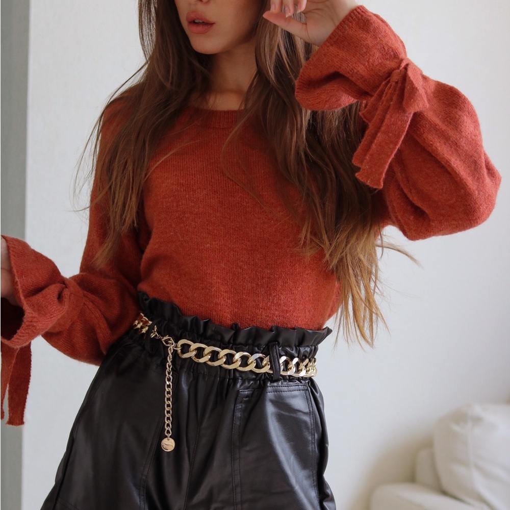 Burnt orange sweater with sleeve bows